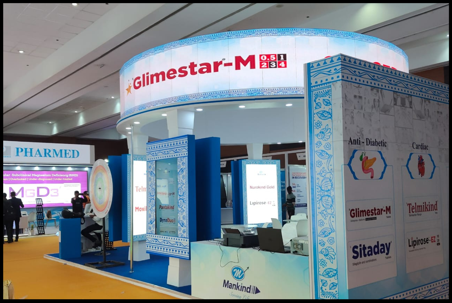 Exhibition booth interior with product showcase and meeting area