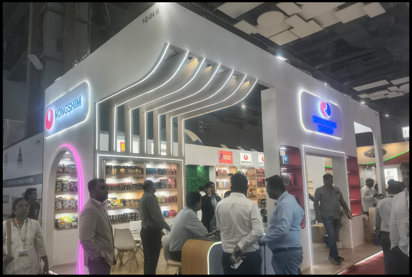 Corporate exhibition stall with reception desk and branding panels